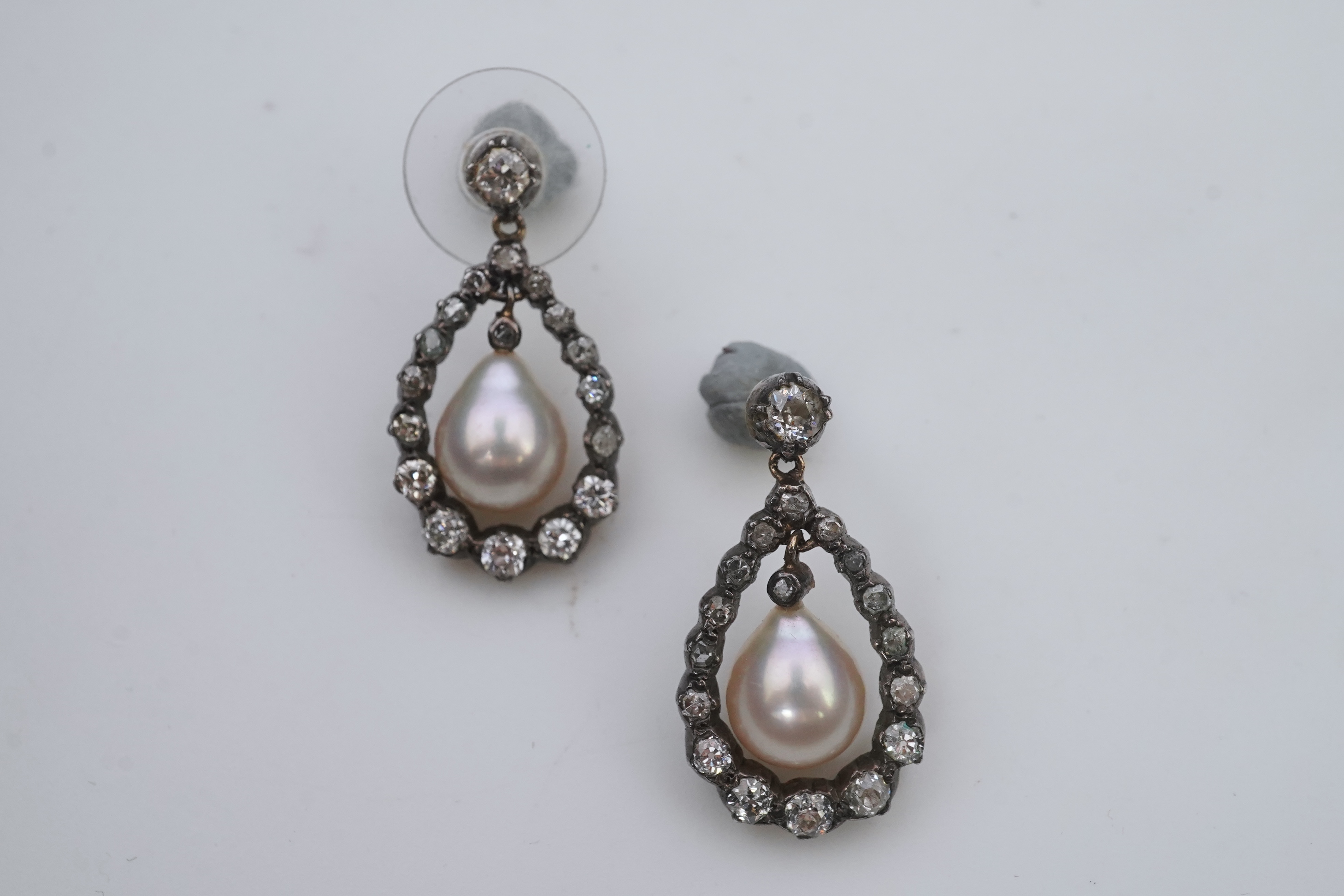 A pair of cultured pearl and diamond earrings